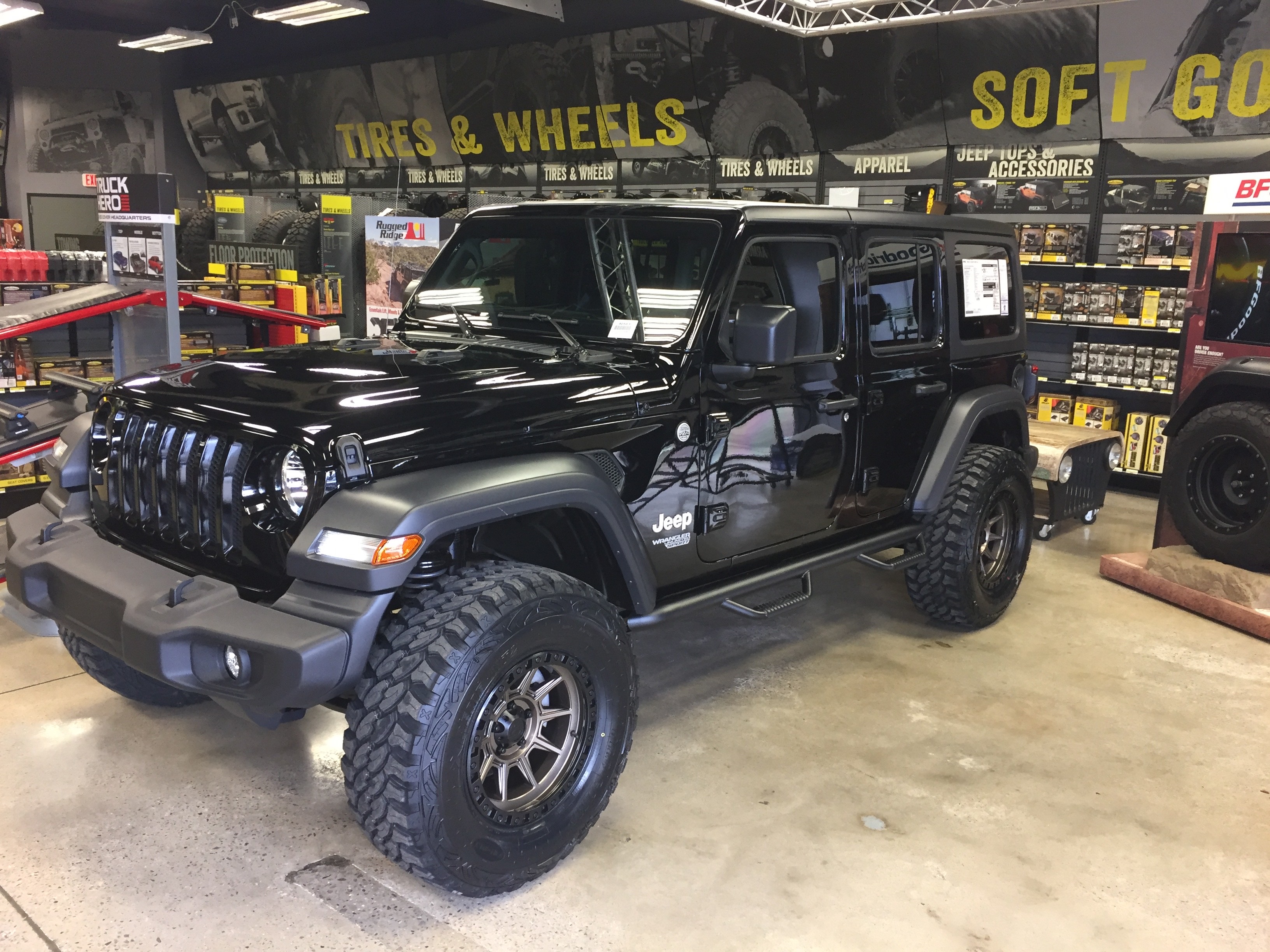 lifted JK Wrangler 2014 Dune color with Atlas bumpers from DSI